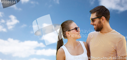 Image of happy couple in sunglasses outdoors in summer
