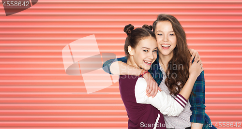 Image of happy teenage girls or friends hugging