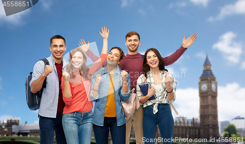 Image of happy students celebrating success over london