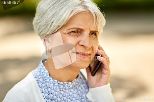 Image of close up of senior woman calling on smartphone