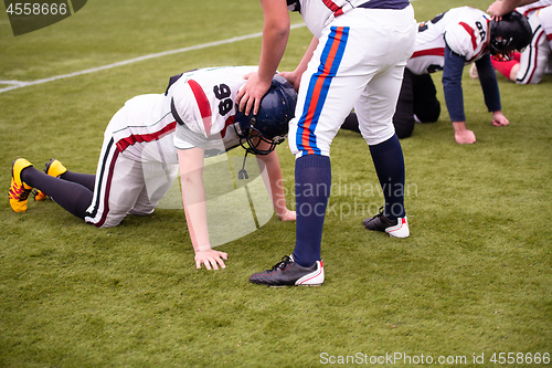 Image of professional american football players training