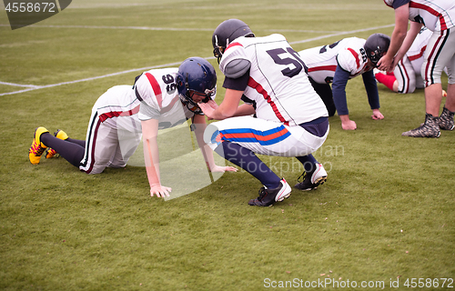 Image of professional american football players training