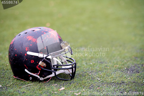 Image of black american football helmet