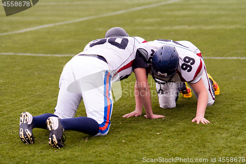 Image of professional american football players training