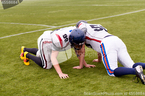 Image of professional american football players training