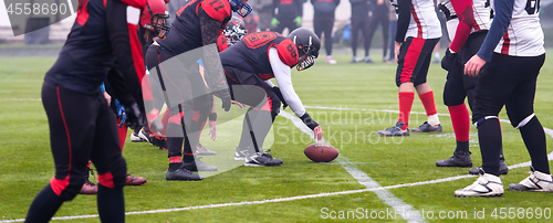 Image of professional american football players ready to start