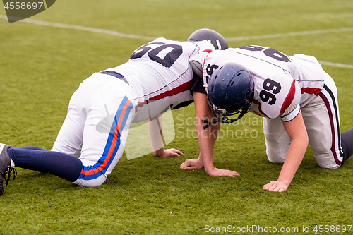 Image of professional american football players training