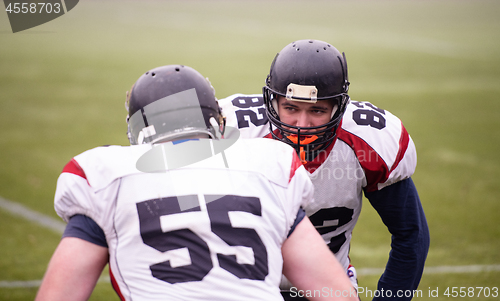 Image of professional american football players training