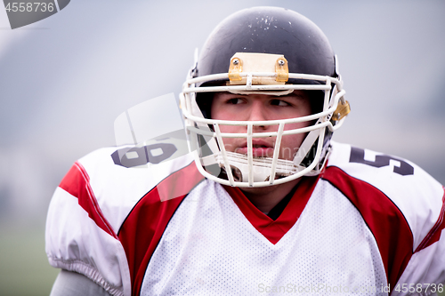 Image of portrait of young confident American football player