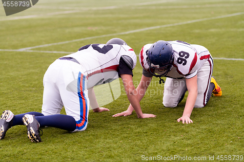 Image of professional american football players training