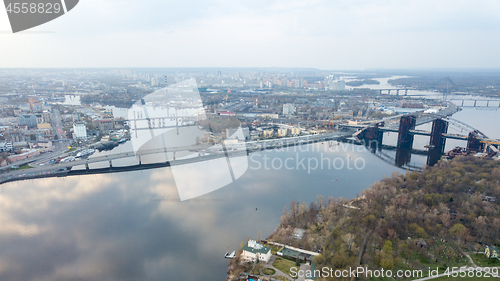Image of Aerial view of the Kiev (Kyiv) city, Ukraine. Dnieper river with bridges. Obolon district in the background