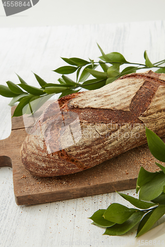 Image of Homemade fresh bread with leaves