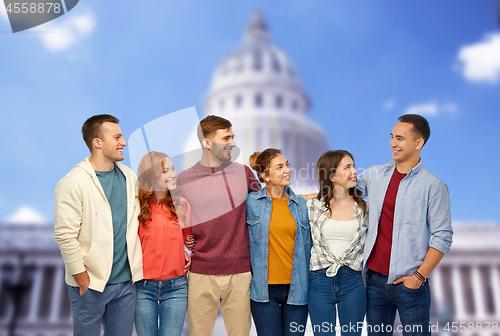 Image of group of smiling friends over capitol building