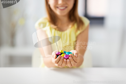 Image of close up of girl holding chocolate easter eggs