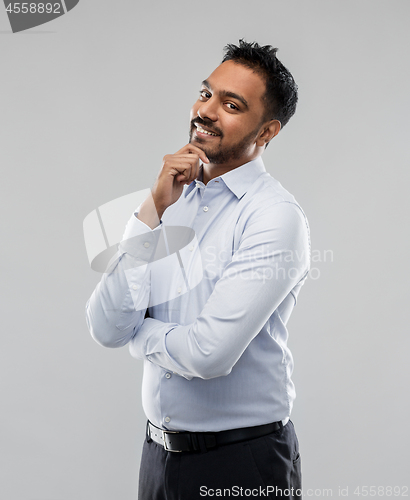 Image of indian businessman in shirt over grey background