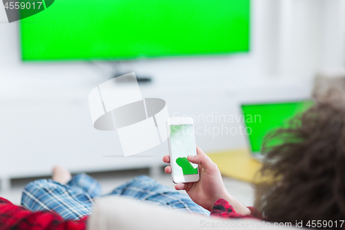 Image of young man in bathrobe enjoying free time