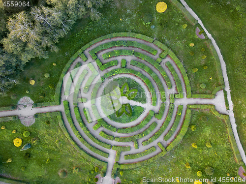 Image of Aerial view of a natural labyrinth in the garden. Photo from the drone