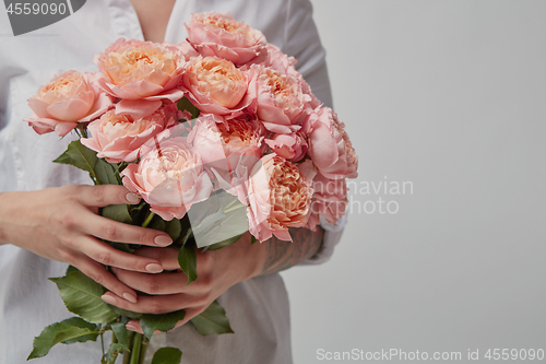 Image of Girl with bouquet of flowers