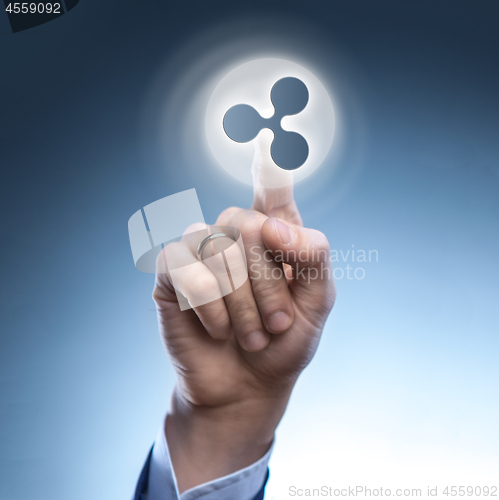 Image of the hand of a man touches a ripple icon