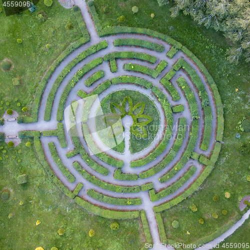 Image of Aerial view of a natural labyrinth round shape in the garden. Photo from the drone.