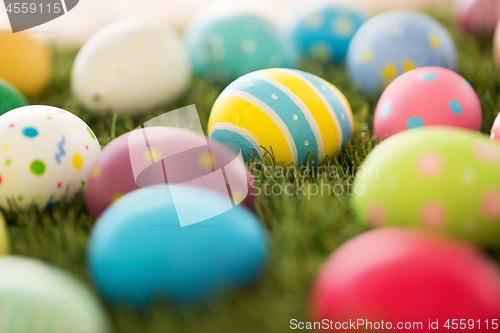 Image of colored easter eggs on artificial grass