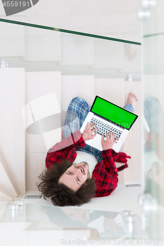 Image of freelancer in bathrobe working from home