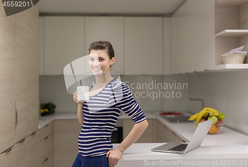 Image of woman drinking coffee enjoying relaxing lifestyle