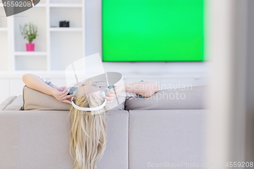 Image of girl enjoying music through headphones