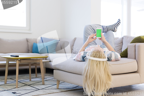 Image of girl enjoying music through headphones