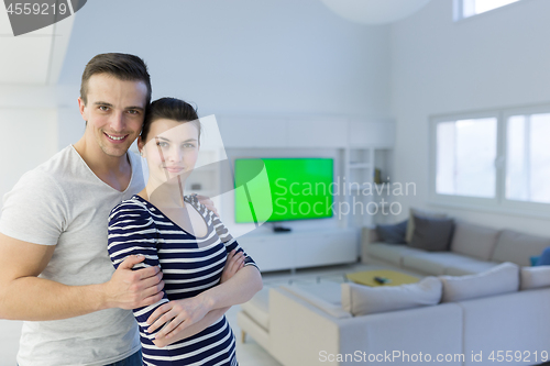 Image of couple hugging in their new home