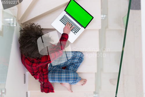 Image of freelancer in bathrobe working from home