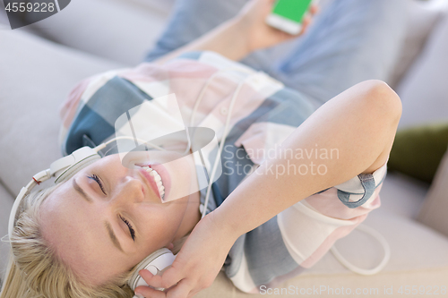 Image of girl enjoying music through headphones