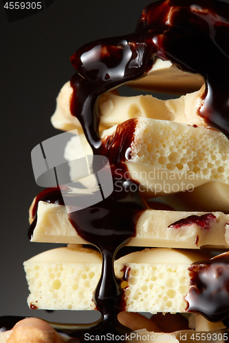 Image of syrop pouring onto a piece of chocolate