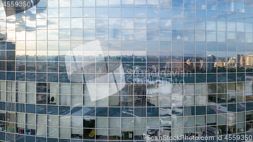 Image of Modern building with reflection of blue sky and clouds. Aerial shot from the drone.
