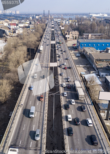 Image of Highway with moving cars and trucks in the city Kiev, Ukraine. Aerial view from drone in a spring day.