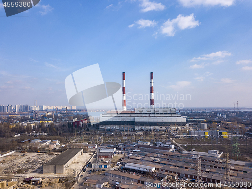 Image of Aerial view from drone of industrial area in a city Kiev, Ukraine with Electric utility Company on a background of blue sky.