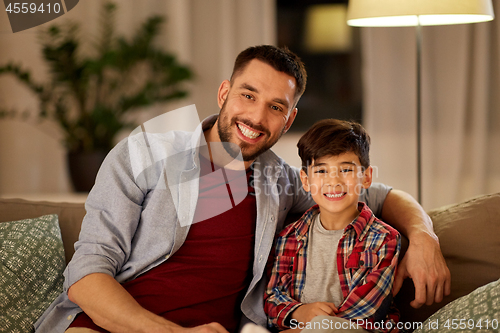 Image of portrait of happy father and little son at home