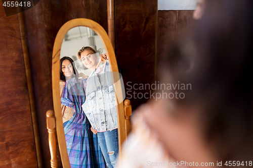 Image of women choosing clothes at vintage clothing store