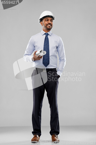 Image of indian architect or businessman with blueprints