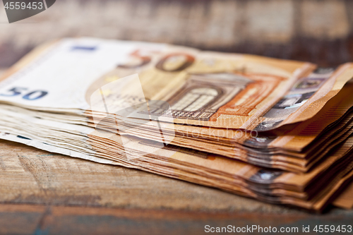 Image of Pile of fifty euro banknotes. 