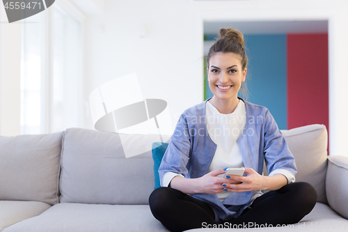 Image of woman using mobile phone