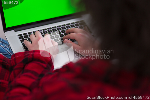 Image of man freelancer in bathrobe working from home