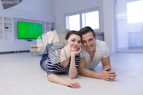 Image of couple lying on the floor at home