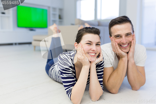 Image of couple lying on the floor at home