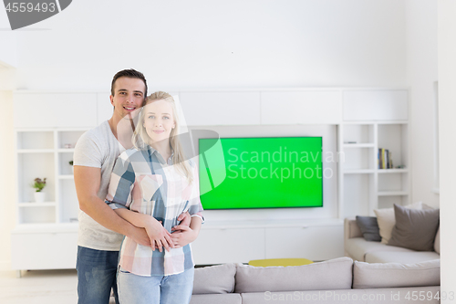 Image of couple hugging in their new home