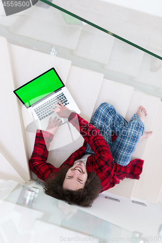 Image of freelancer in bathrobe working from home