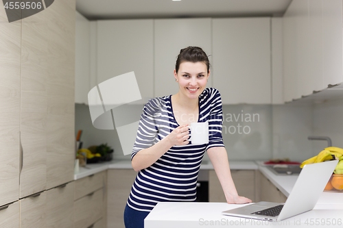 Image of woman drinking coffee enjoying relaxing lifestyle