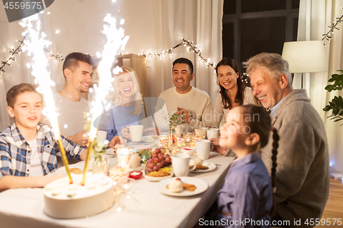 Image of happy family having dinner party at home