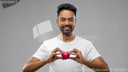 Image of indian man with red heart over grey background