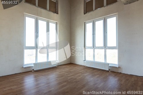 Image of Room interior with two corner stained glass windows